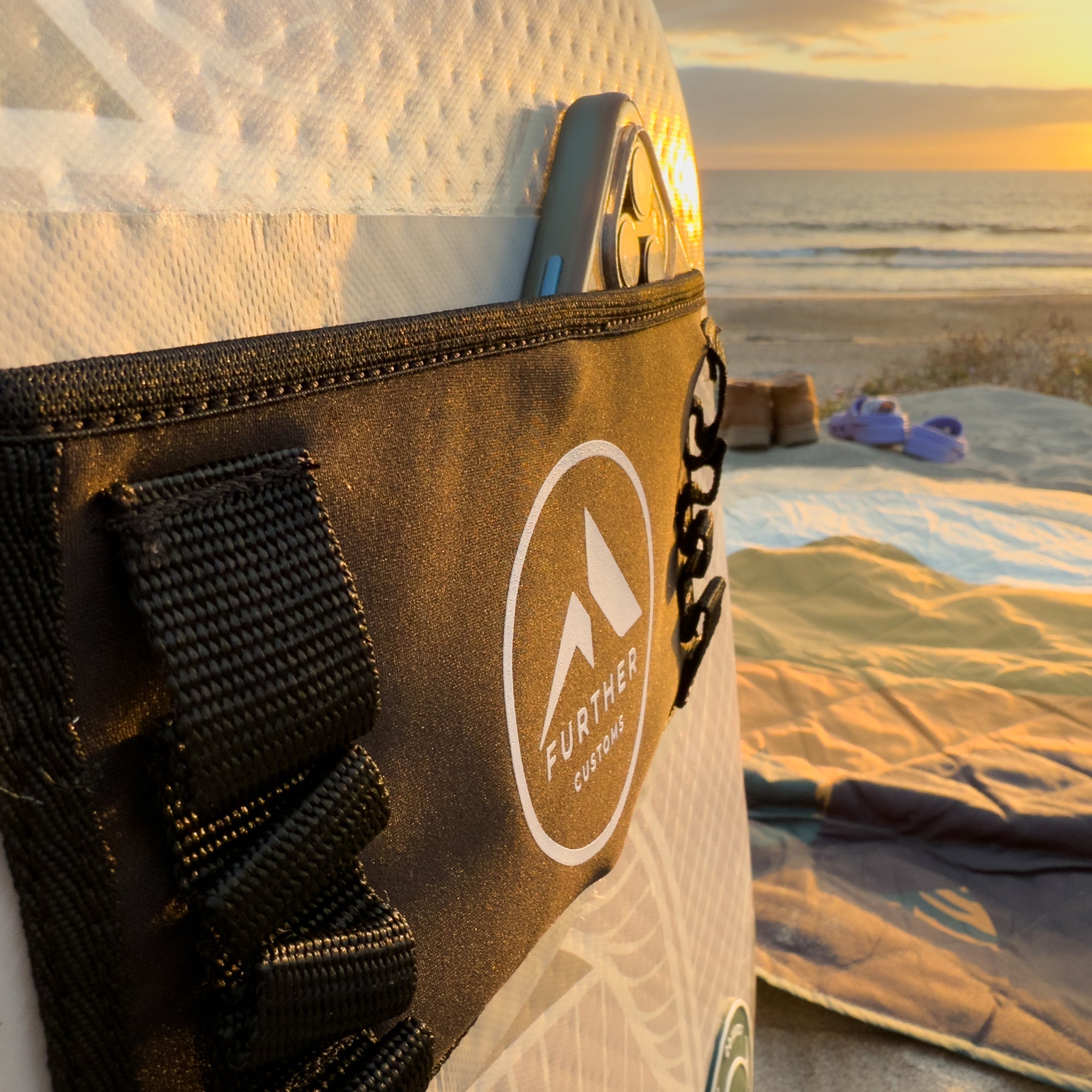 Inflatable Captain's Chair by Further Customs, featuring a packable design and neoprene pocket for beach use.