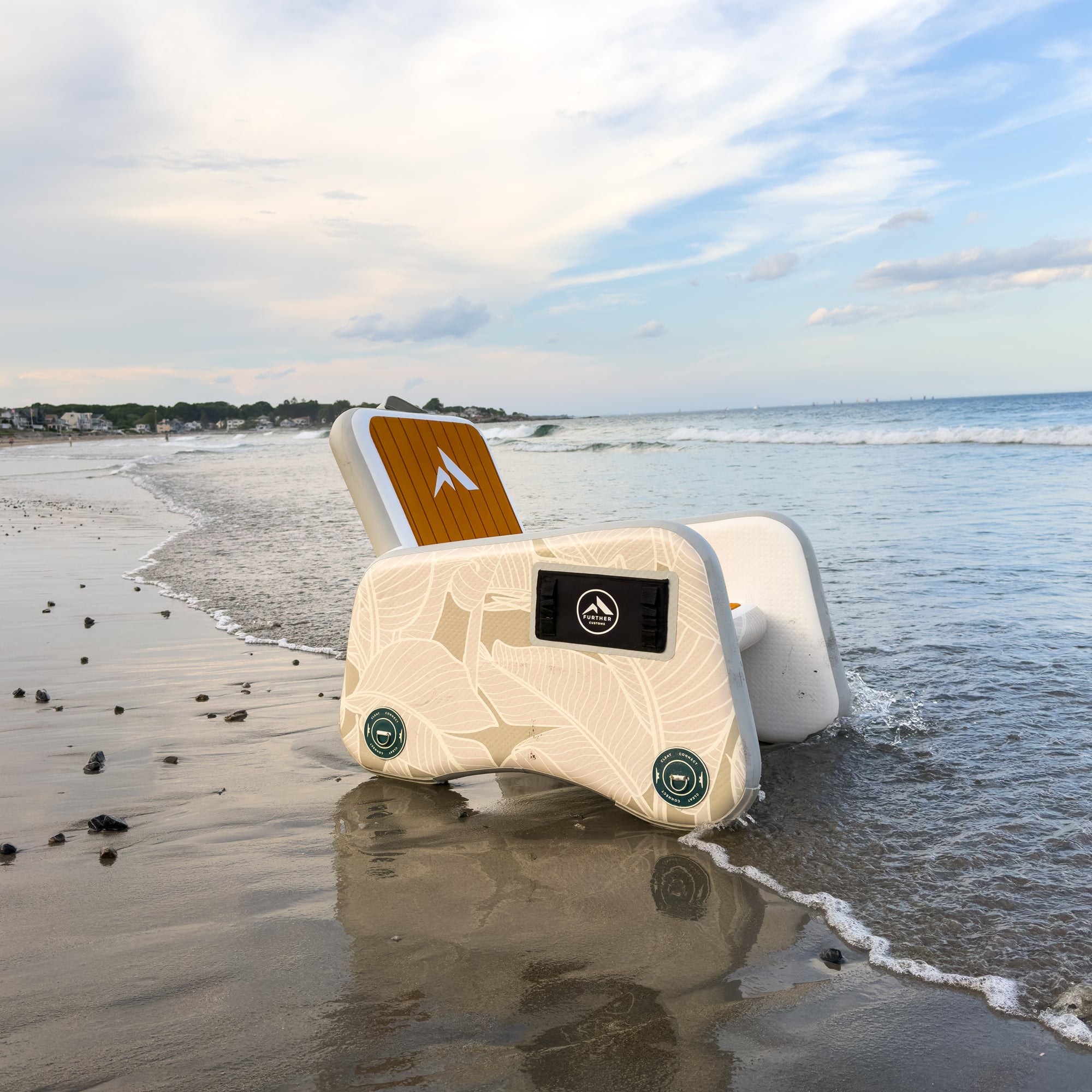 Inflatable Captains Chair by Further Customs, featuring a portable design for beach and shoreline relaxation.