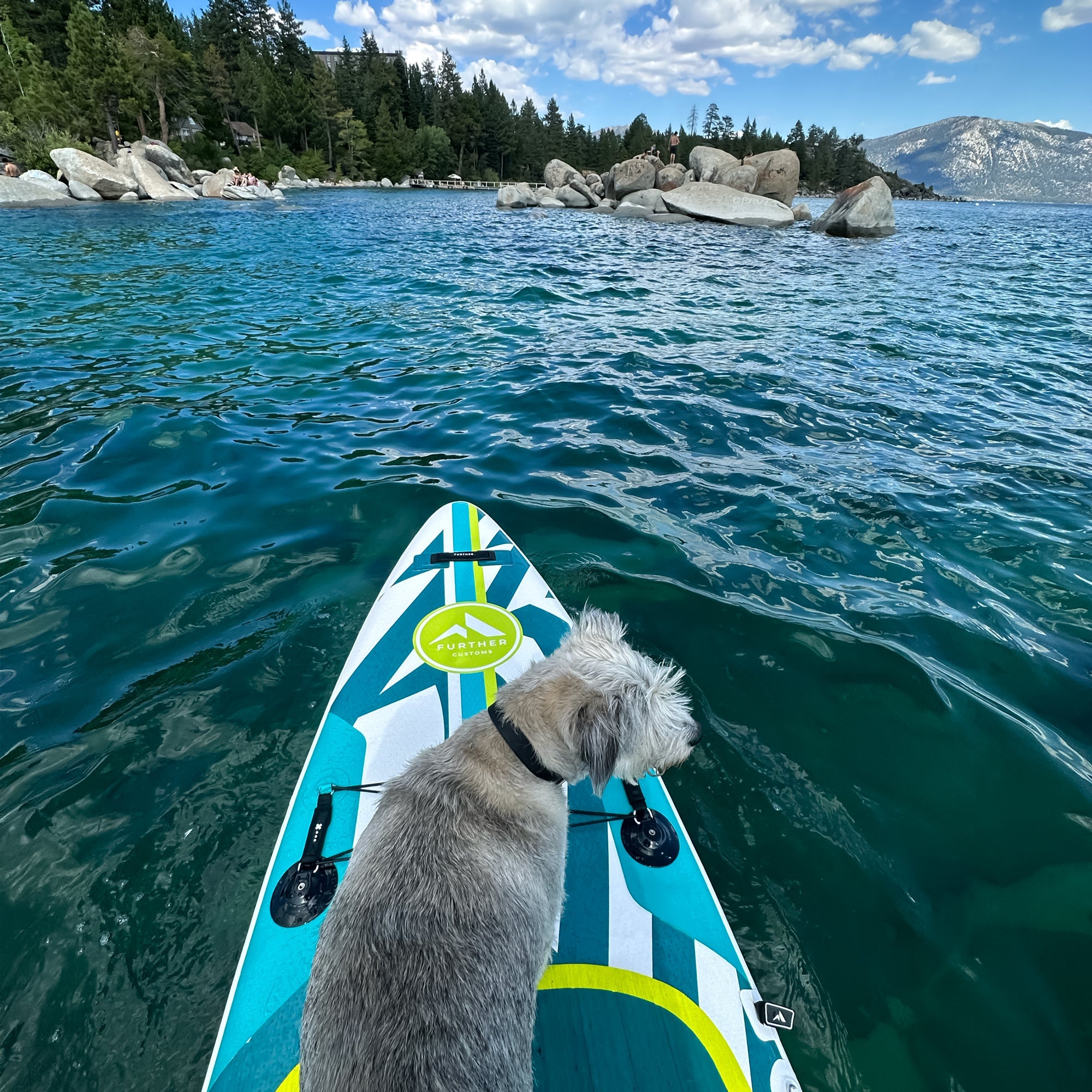 Turquoise 11'3 Further Customs Podium inflatable paddleboard with a sleek design, suitable for stand-up paddleboarding and water adventures