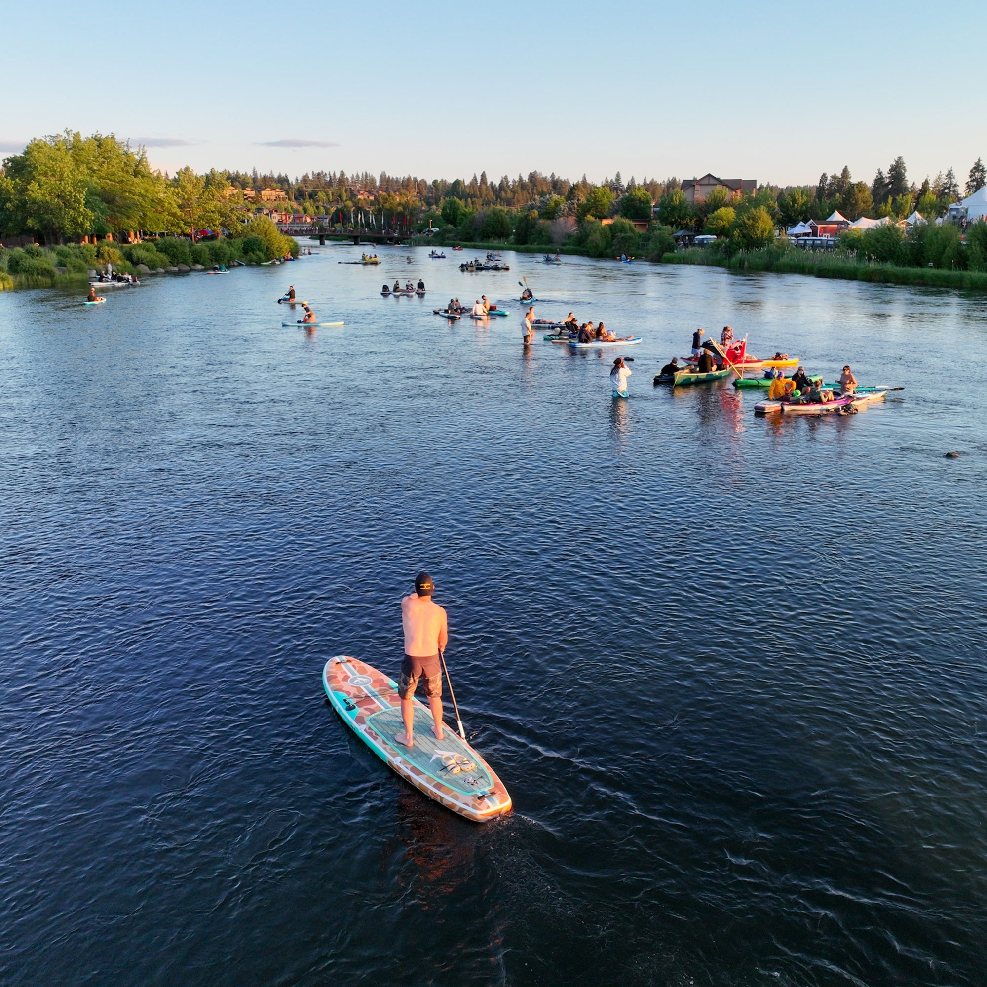 Further Customs 11'0 Tamarack Sage inflatable paddleboard on Oregon's Deschutes River, ready for paddleboarding adventures.