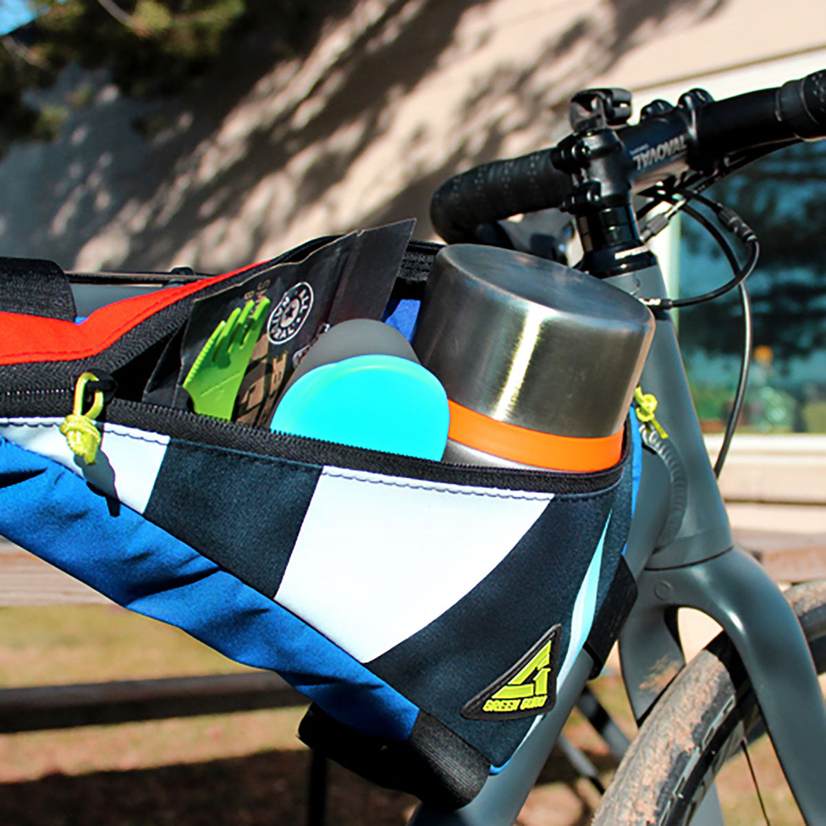 Large green Guru Upshift frame bag by ZEITBIKE, designed for bike storage, with adjustable straps and durable fabric.