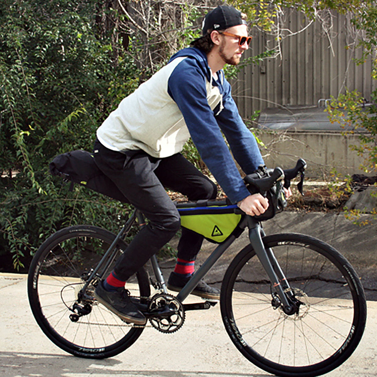 Large green UpShift frame bag by ZEITBIKE from Green Guru, designed for bike storage, shown mounted on bicycle frame.