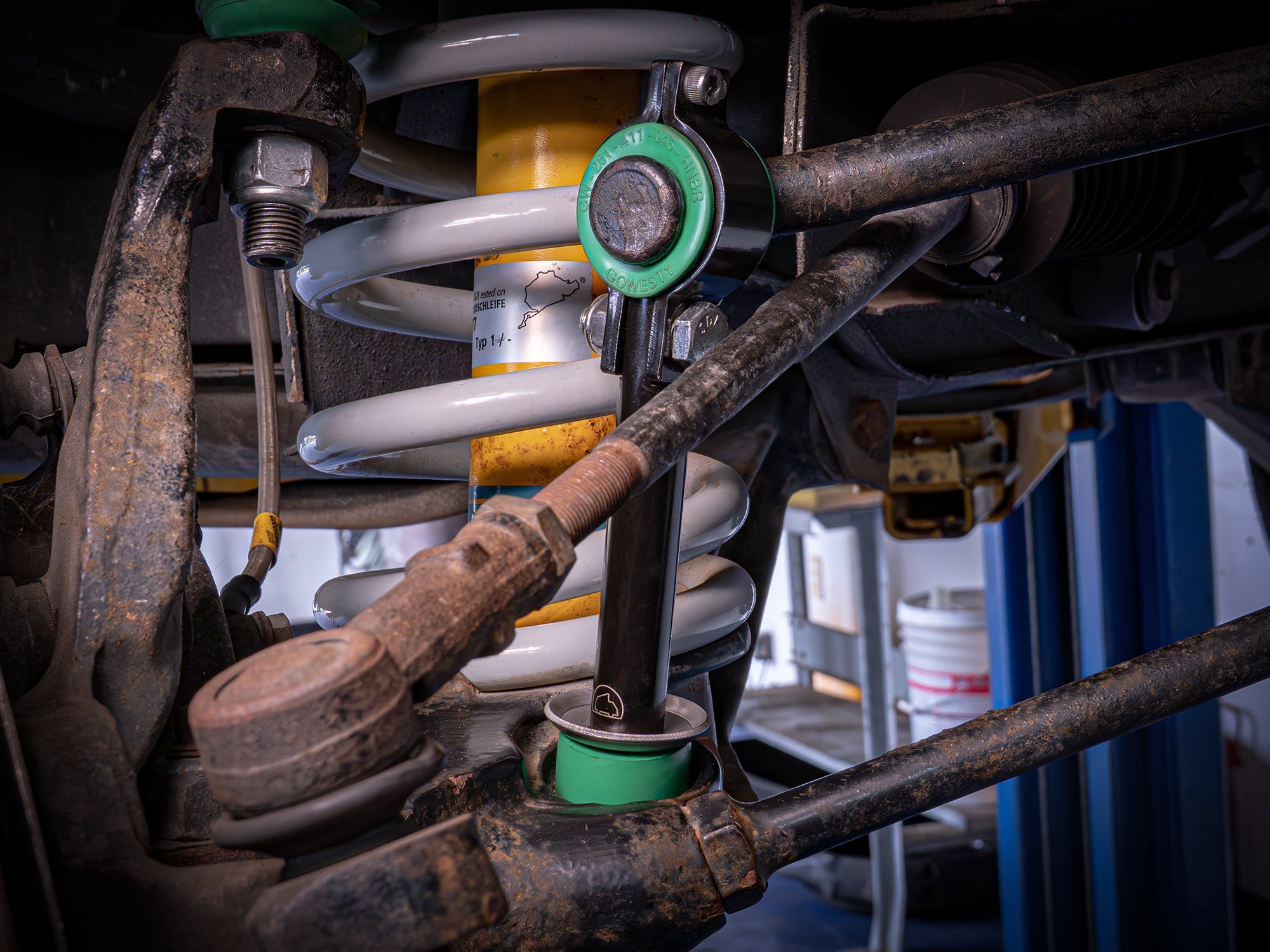 GoWesty front sway bar bushing bundle installed on a Vanagon, showing the bushings in a vehicle suspension setting.