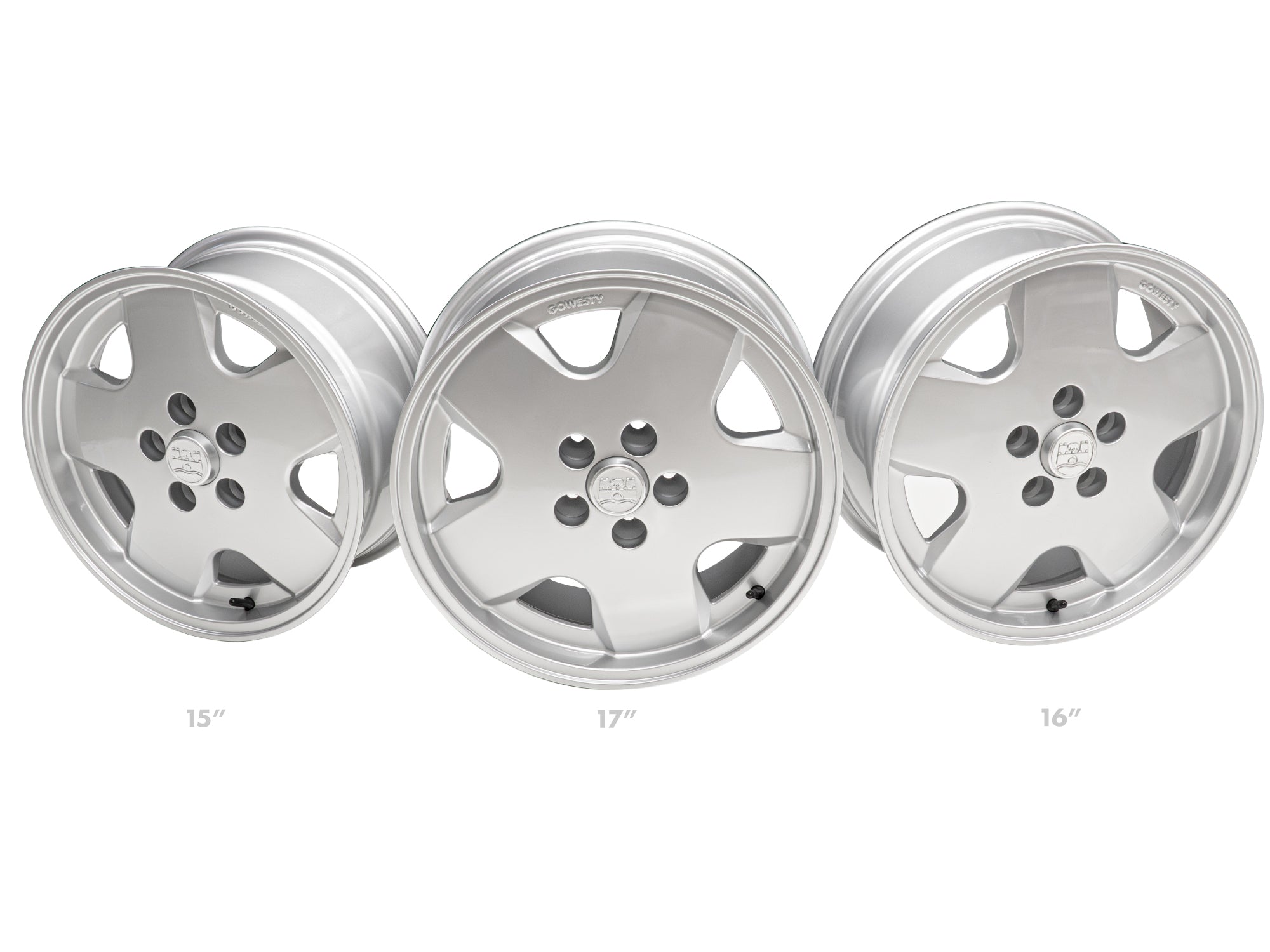 Set of GoWesty OEM replica alloy wheels for Bus and Vanagon, featuring three different sizes with matching tires and accessories.