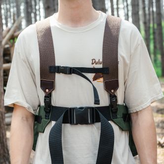Backcountry Sportsman All Day Lumbar Pack with adjustable straps and multiple compartments, shown in a scenic outdoor setting.