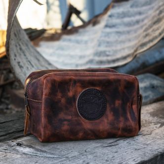 Backcountry Sportsman Heritage Leather Kit Bag made of waxed bison leather, with a compact, rugged design for outdoor gear storage.