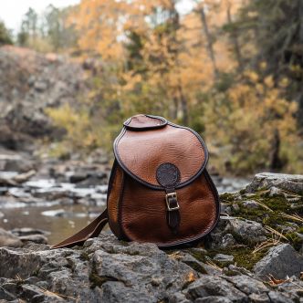 Backcountry Sportsman Bison Leather Lady Slipper Pack in brown, featuring sturdy leather construction and adjustable straps.