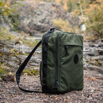 Backcountry Sportsman Convertible Jet-Setter duffel bag in autumn colors, with sturdy handles and spacious design for travel.