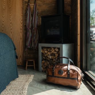 Backcountry Sportsman Bison Leather Weekender Duffel bag with sturdy leather straps and spacious interior, ideal for travel and weekend trips.