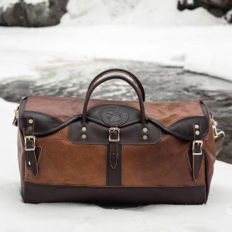 Backcountry Sportsman Bison Leather Sportsman's Duffel bag with sturdy handles and rugged design, suitable for travel and outdoor adventures.