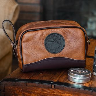 Backcountry Sportsman Bison Leather Sportsman's Kit Bag with leather straps and metal hardware, shown on a neutral background.