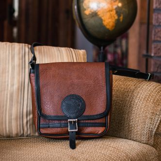 Backcountry Sportsman Bison Leather Mini Haversack with adjustable strap, front pocket, and vintage leather finish.