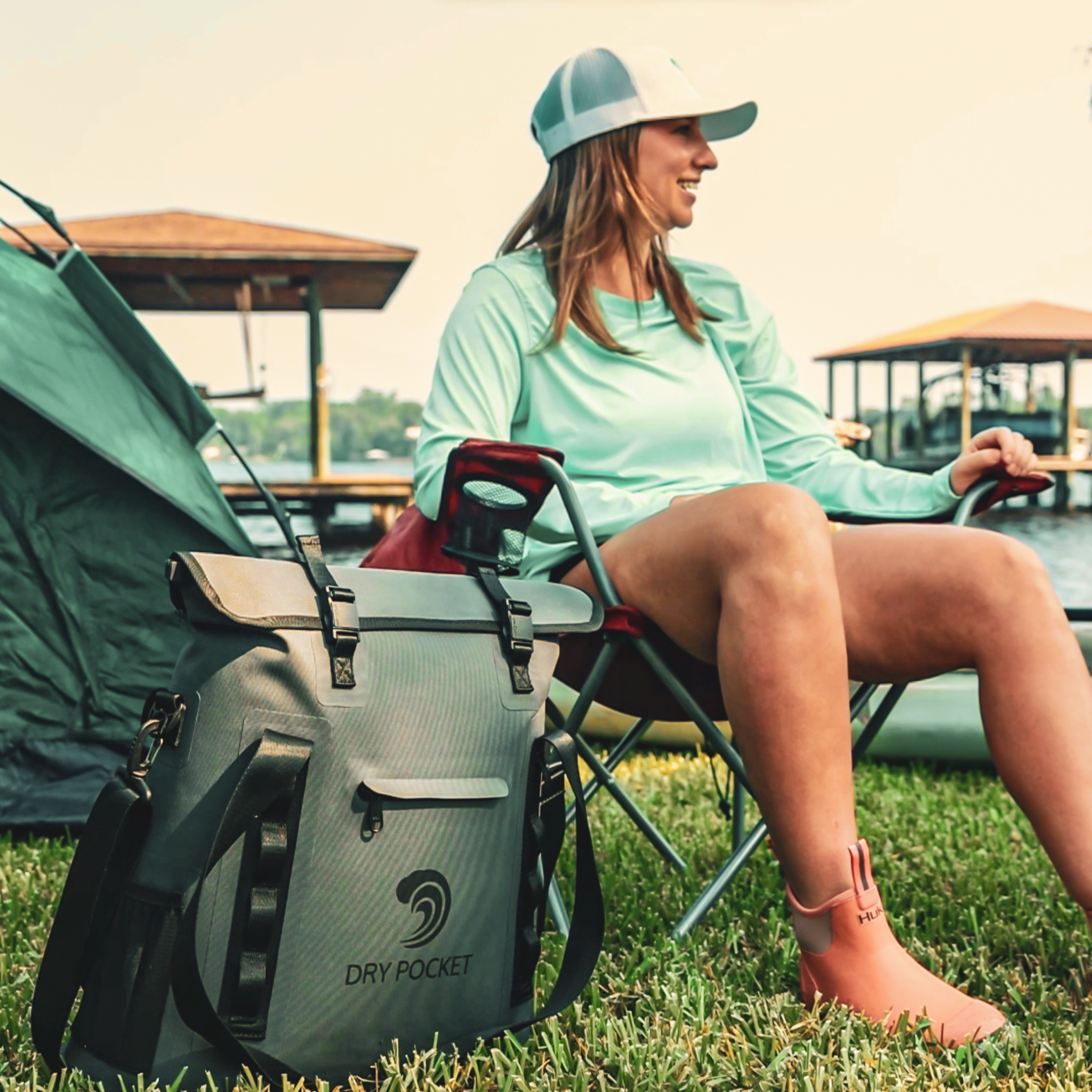 Grey Dry Pocket waterproof floating tote cooler with auto-sealing lid, designed for outdoor and aquatic use.