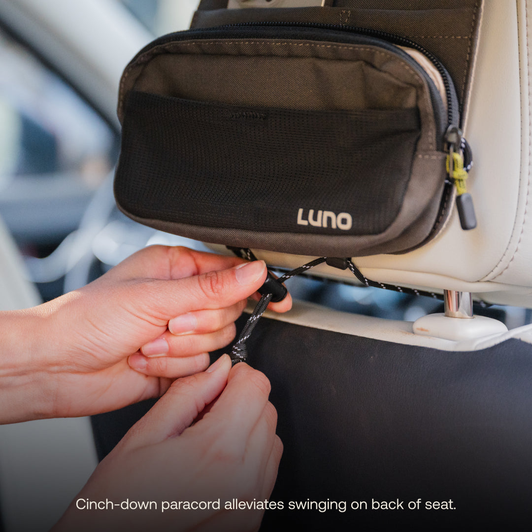 Luno® headrest organizer featuring multiple pockets for convenient storage in a car interior.