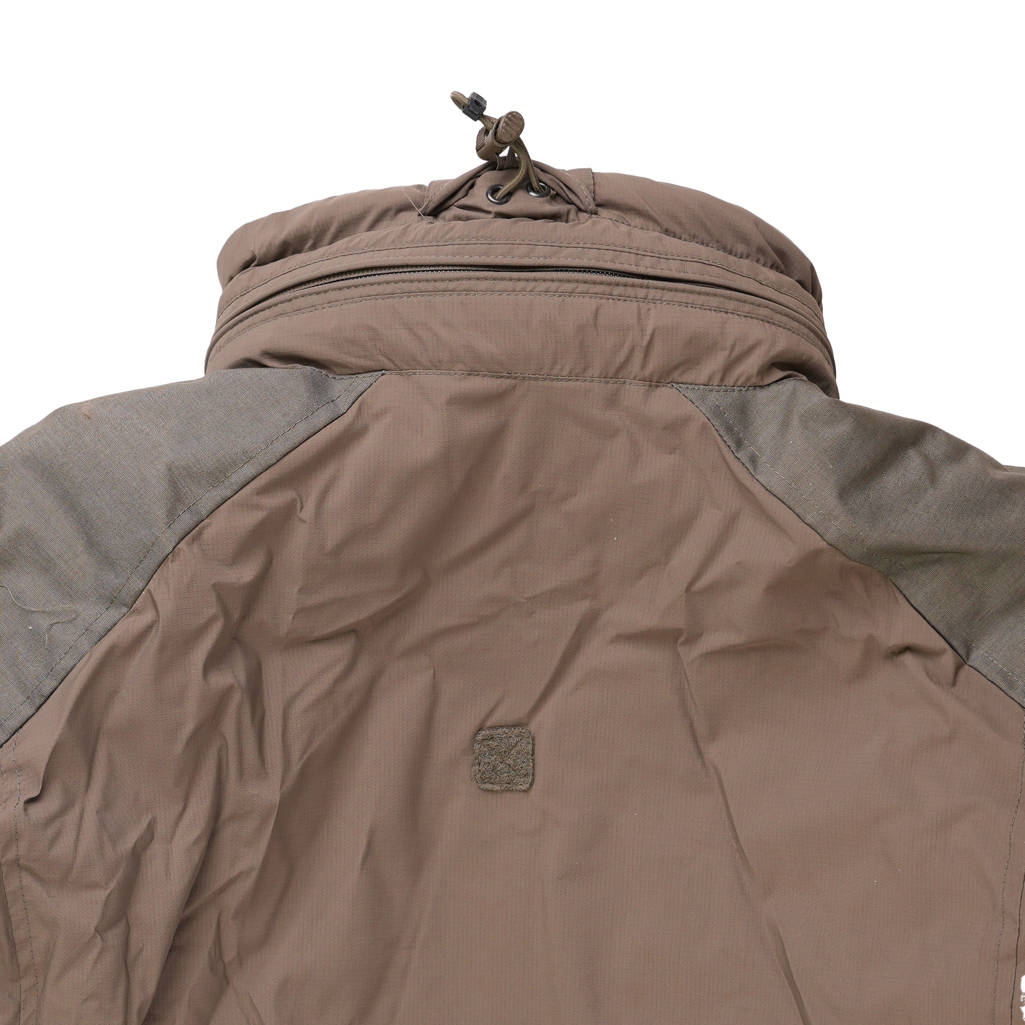 Americana Pipedream Apparel Carinthia HIG 4.0 jacket with adjustable neck strap and zipper detail, close-up view of the neck area.