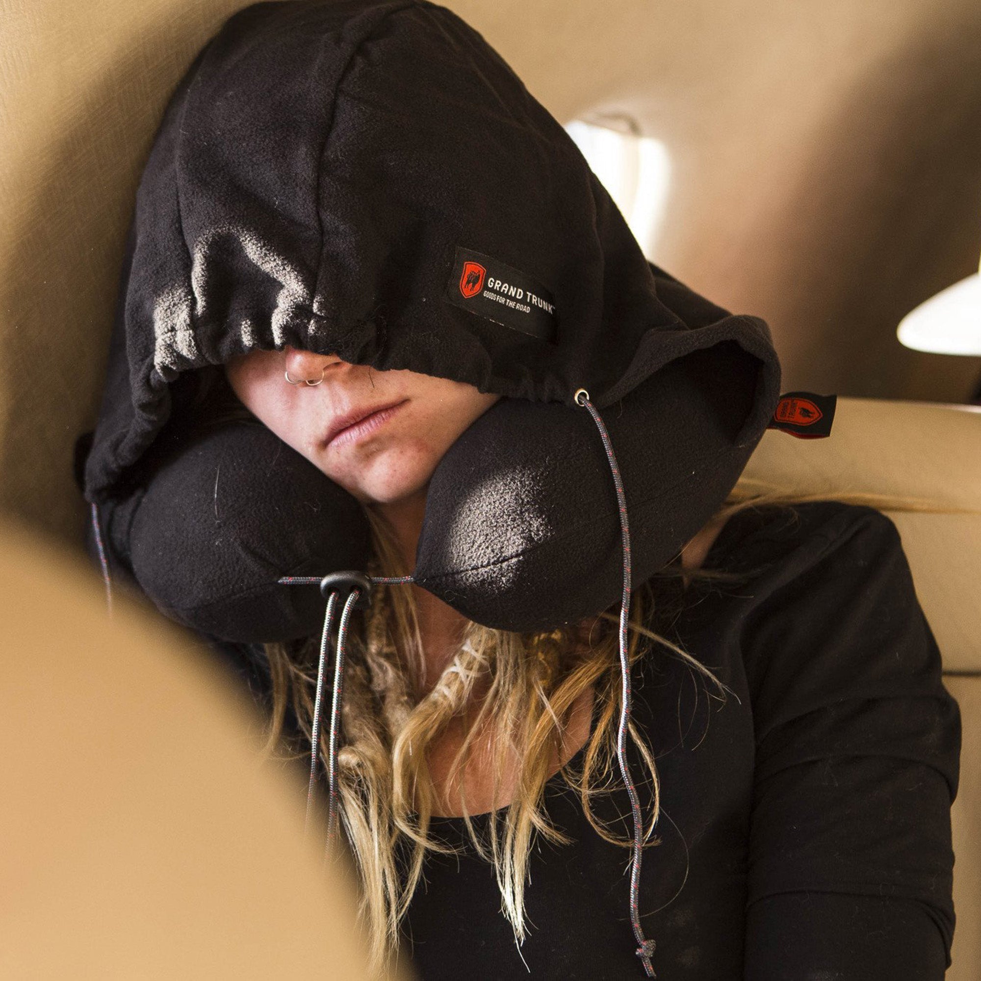 GrandTrunk hooded travel neck pillow in a cozy design, perfect for comfort during travel or relaxation.