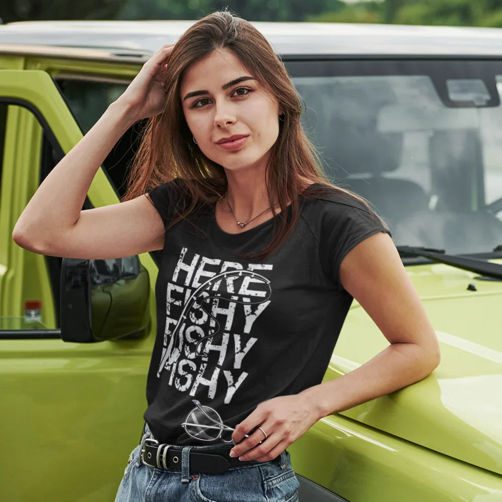 Black Here Fishy Fishy T-Shirt for Women by Outdoorzees, featuring a fish graphic on the front, worn by a female model.