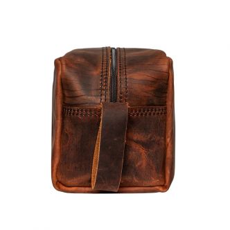 Backcountry Sportsman Heritage Leather Kit Bag shown from side view with durable leather construction and classic design.
