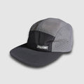 Black and grey crushable 5-panel camper hat by Faultline395, shown in a stylish outdoor setting.