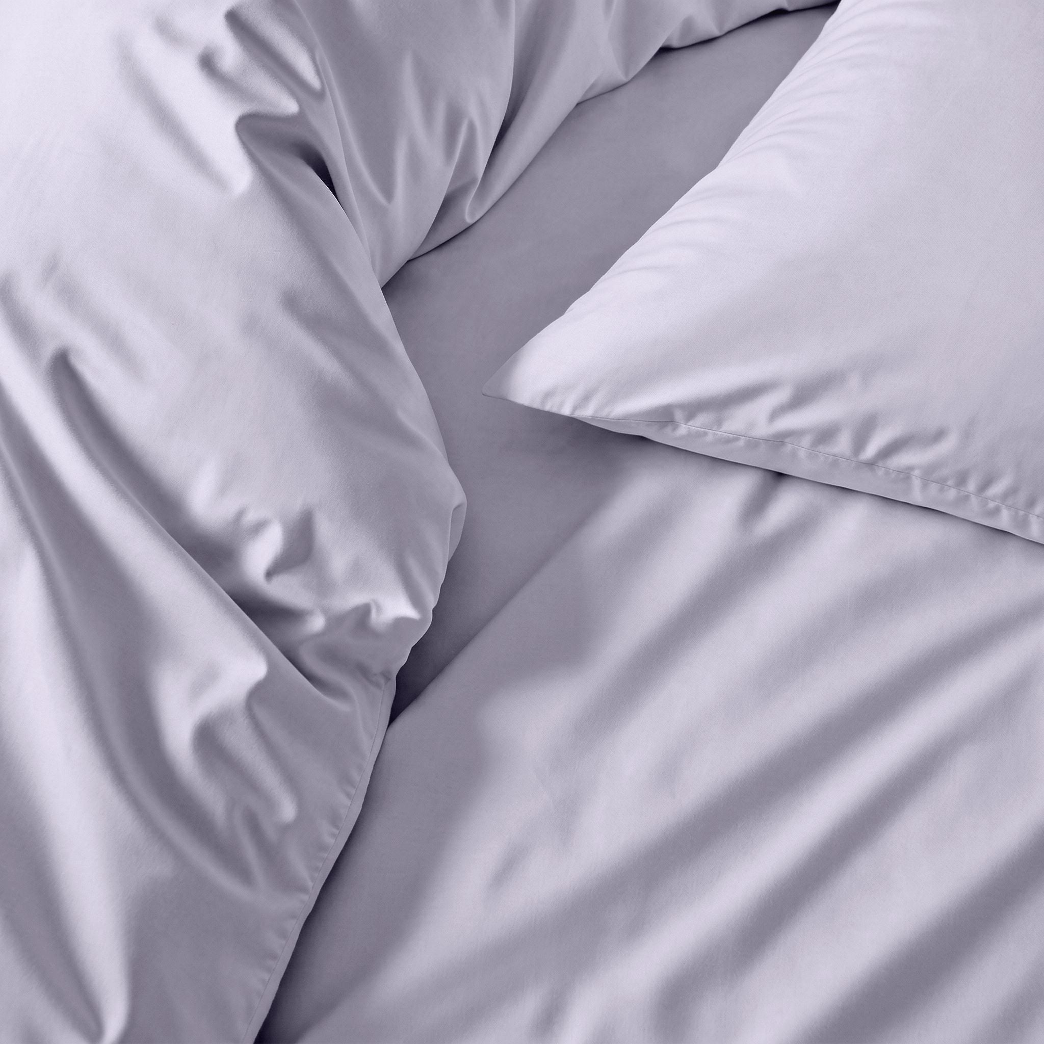 Elegant white Luxe Australian Sateen duvet cover by Italic, showcasing smooth, luxurious fabric on a neatly made bed.