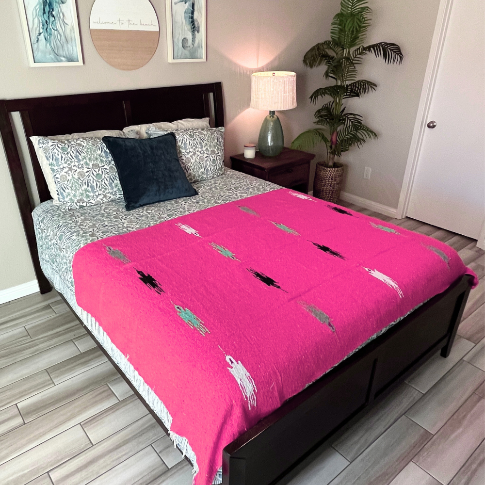Hot pink Baja Thunderbird blanket by West Path featuring bold Thunderbird design on soft, cozy fabric.