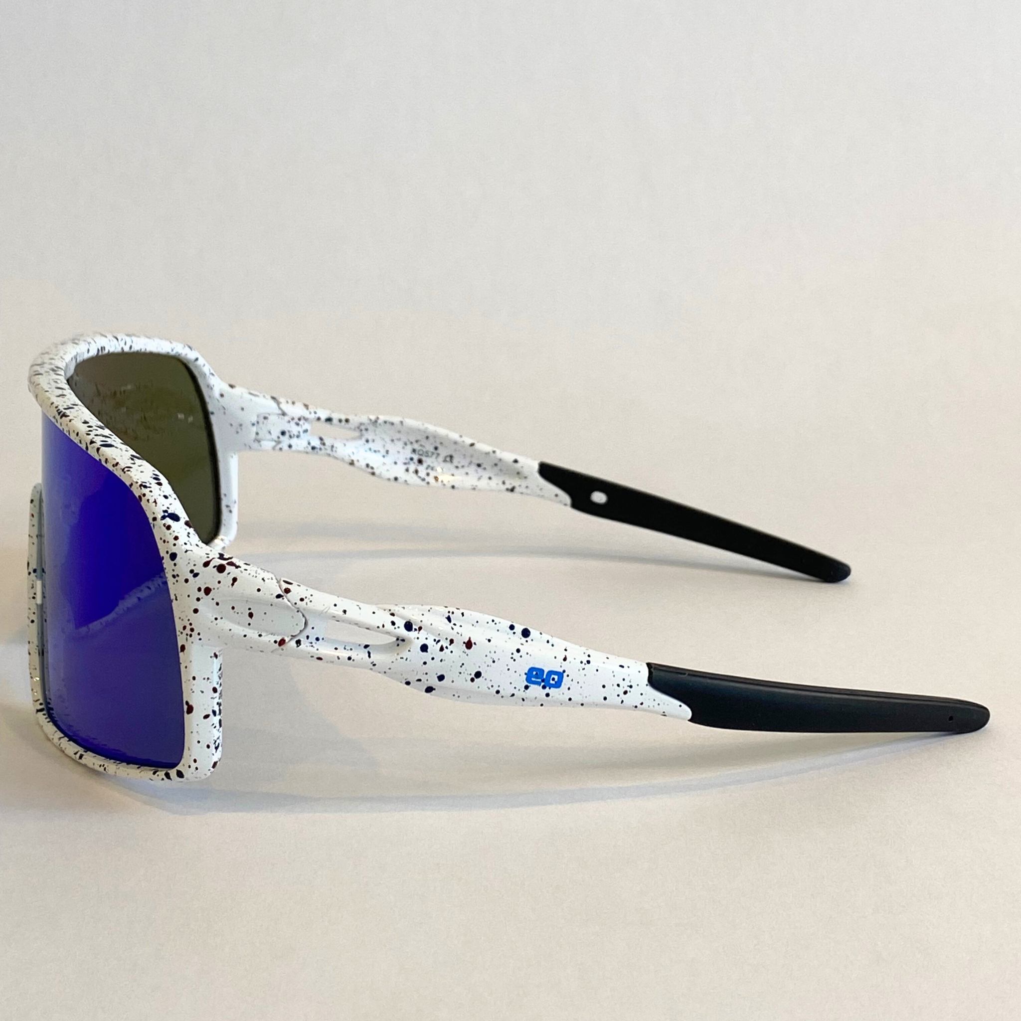 Flying Dog Snowstorm sunglasses with blue-mirror Revo lens by Eastern Outer, shown from the left side.