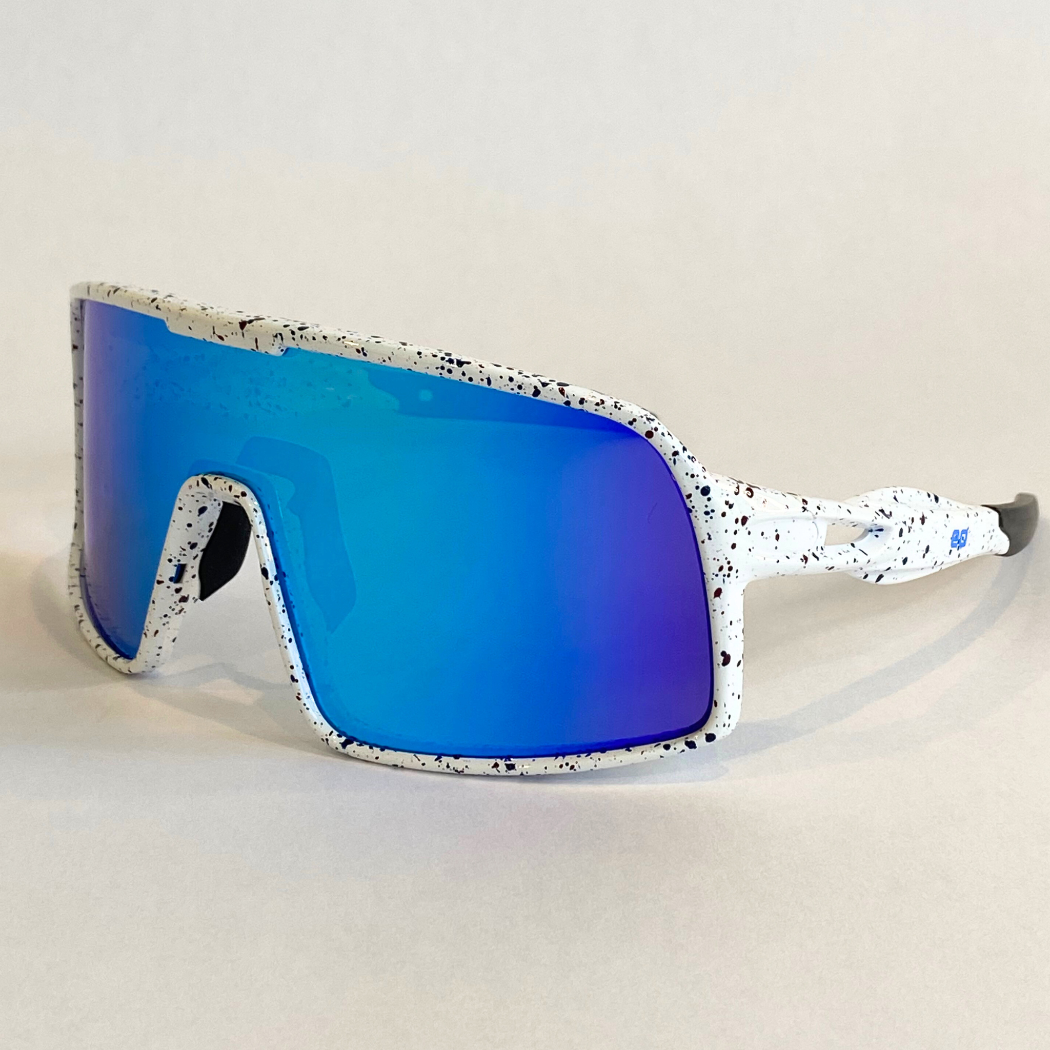 Eastern Outer Flying Dog Snowstorm sunglasses with blue-mirror Revo lenses, viewed from a left angle highlighting the frame and lenses.