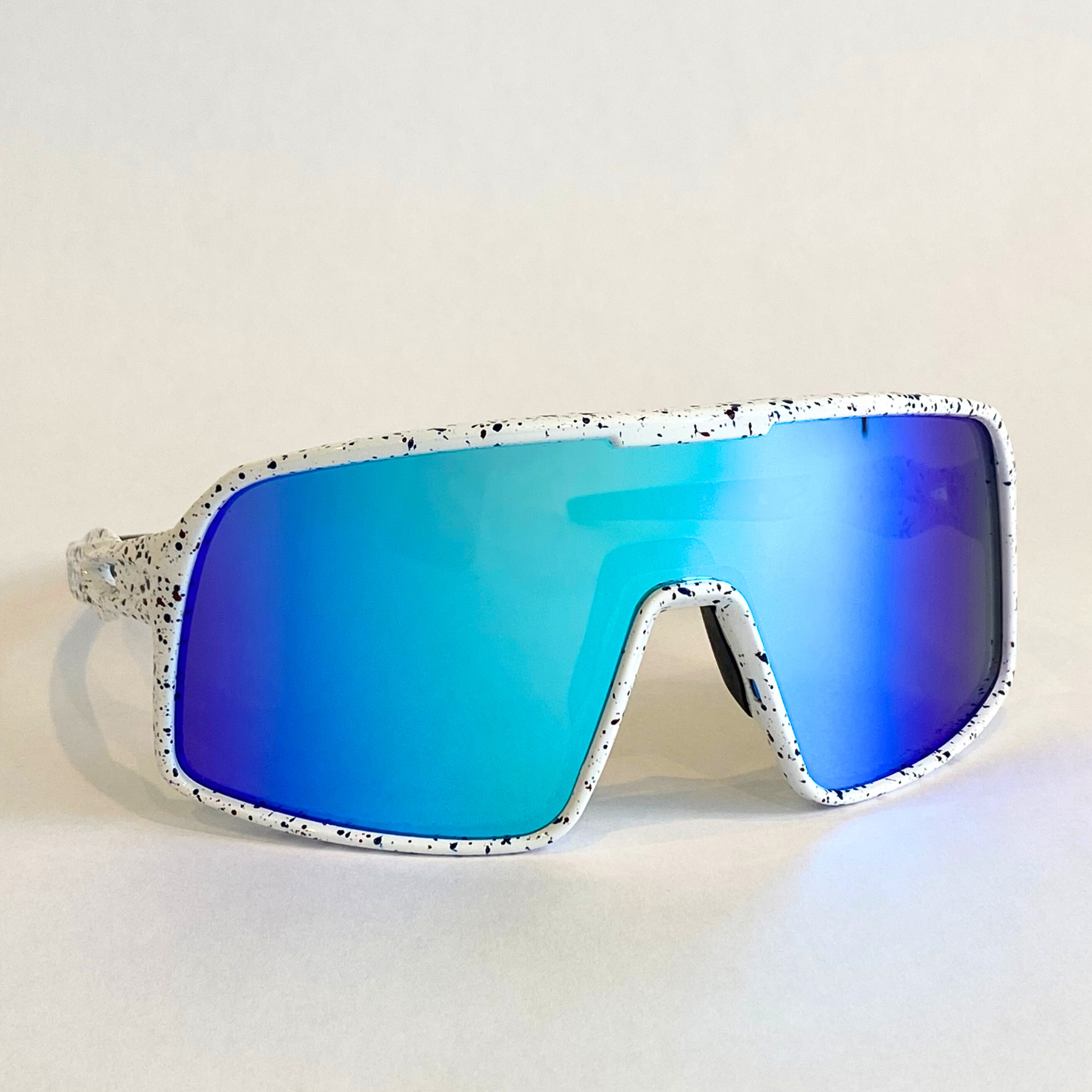 Flying Dog Snowstorm sunglasses with blue-mirror Revo lenses by Eastern Outer, shown from a right-angle perspective.