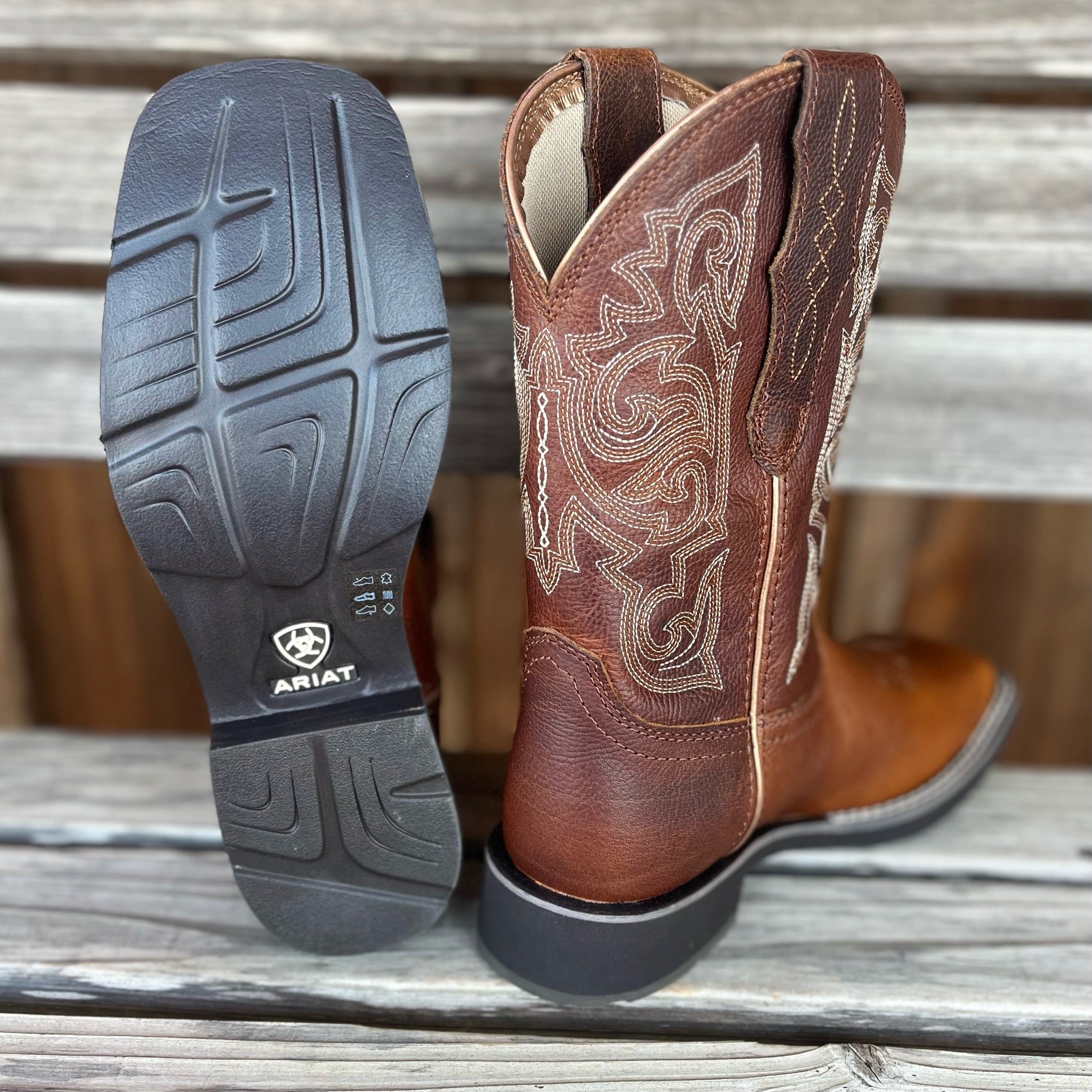 Ariat Delilah Stretchfit women's western boots with pointed toes, intricate stitching, and a sleek leather finish.