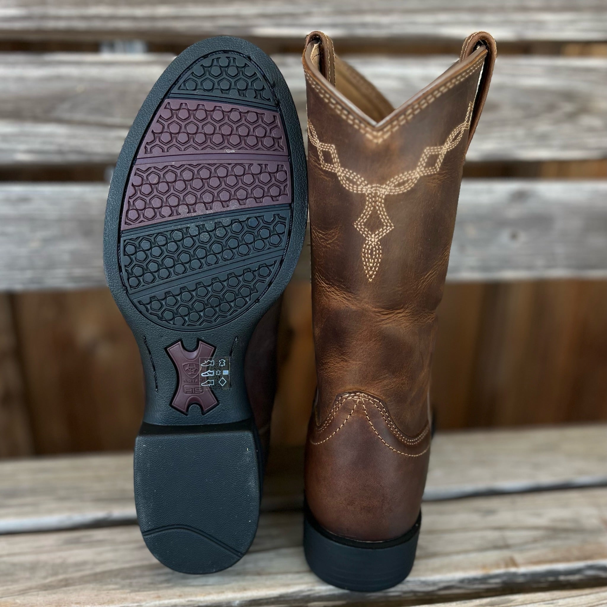 Ariat Heritage Roper women's Western boots with tan leather, decorative stitching, and cowboy heel on a neutral background.