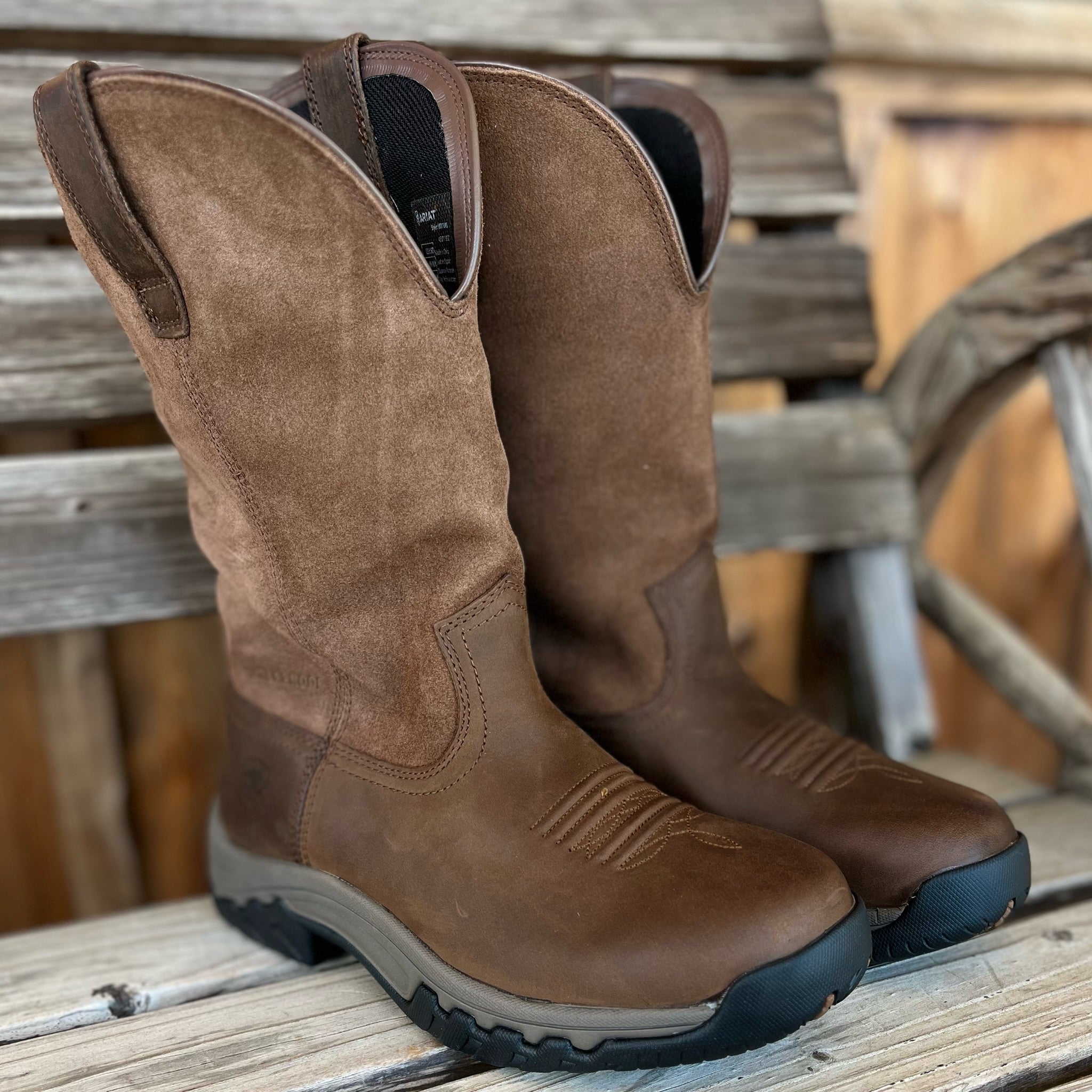Ariat Women's Pull-On Terrain H2O Western Boots in brown leather with rugged sole and Western stitching, suitable for outdoor wear.