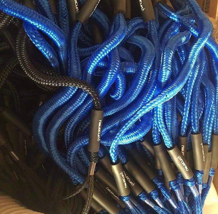 Two NautiCurl LLC Bungee boat ropes with shock-absorbing features, designed as marine accessories for secure towing and docking.