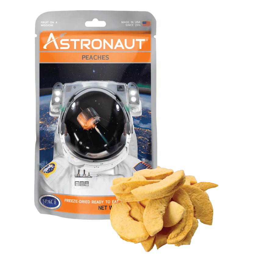 Astronaut freeze dried peaches from Alpenglow Readiness Supply in a resealable pouch, perfect for outdoor adventures.