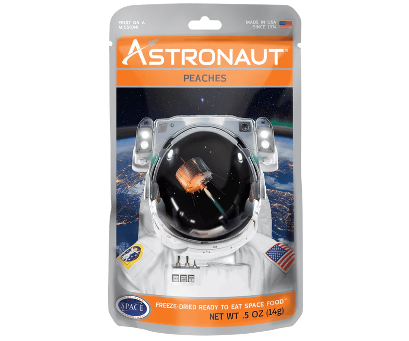 Astronaut freeze dried peaches in a clear packaging, perfect for outdoor adventures by Alpenglow Readiness Supply.