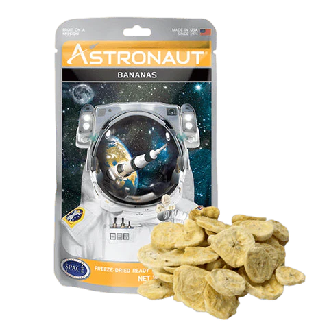 Alpenglow Readiness Supply astronaut freeze dried bananas in a clear pouch on a wooden surface.
