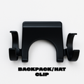 Last Light LLC headlamp hat clip attached to a backpack, providing hands-free lighting for outdoor activities.