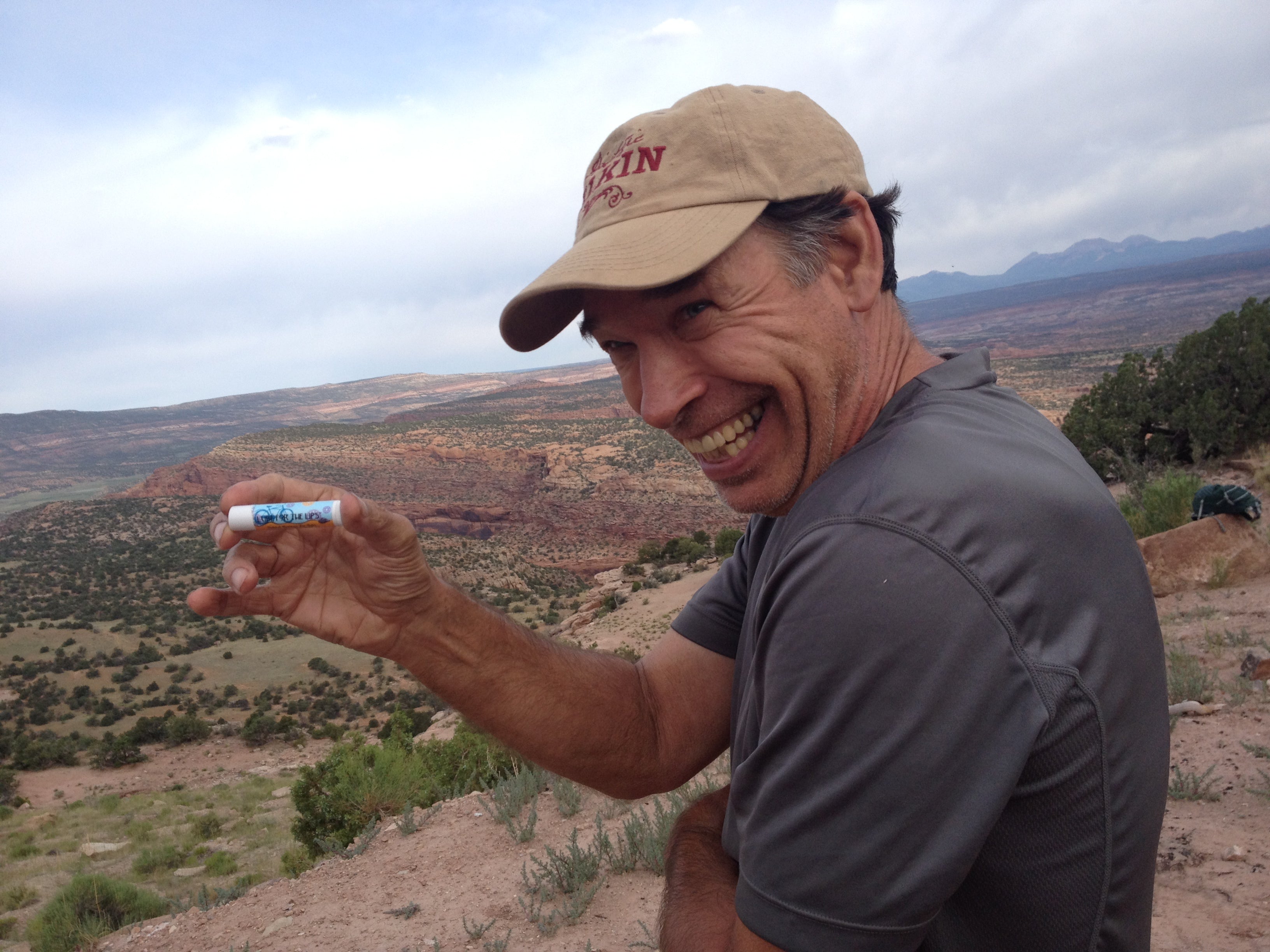 Essential Journeys Honey Vanilla SPF 15 Lip Lube, smooth and nourishing lip balm with sun protection, shown in a close-up image.