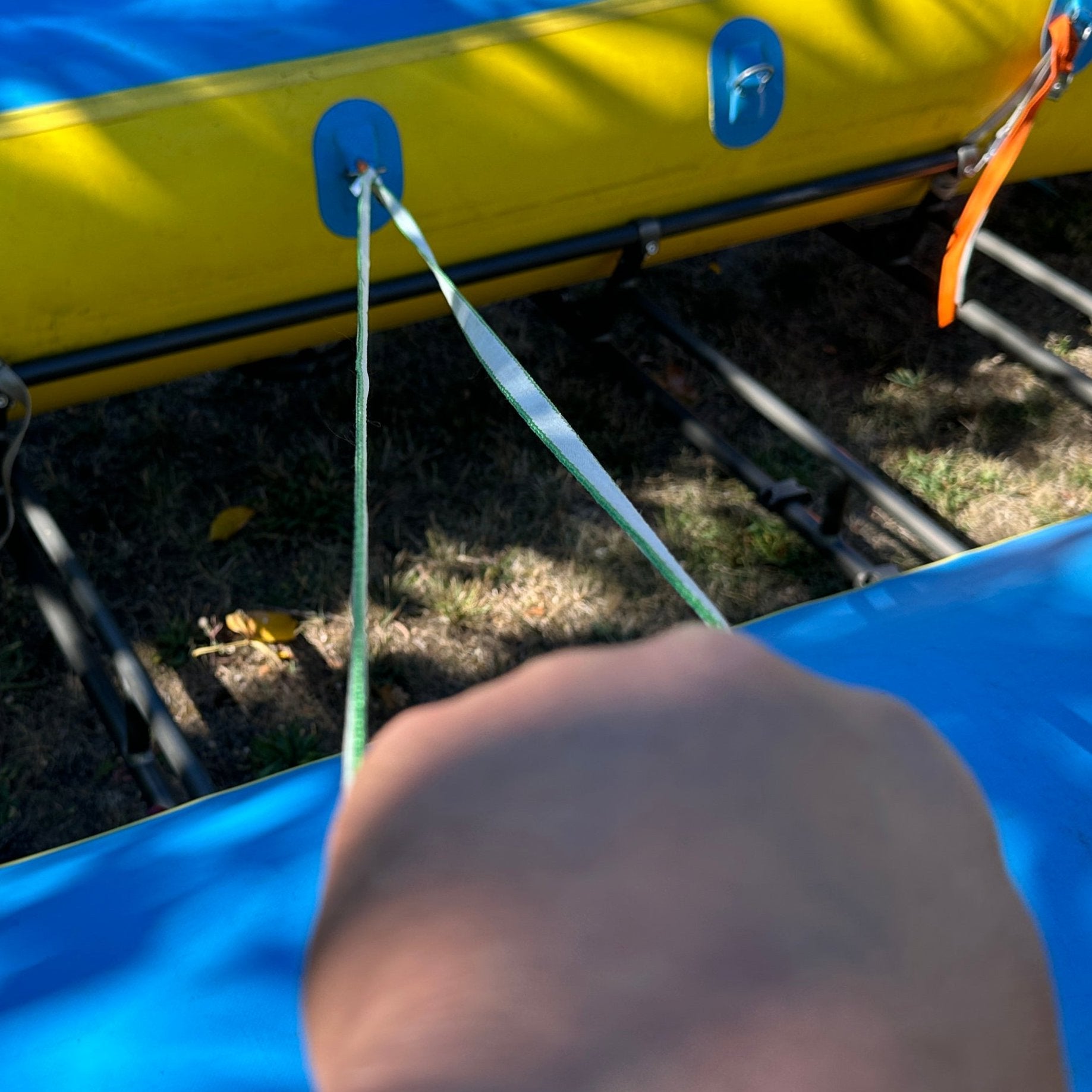 River Hardware rafting flip line with durable nylon strap and metal clip, designed for safety during whitewater rafting adventures.