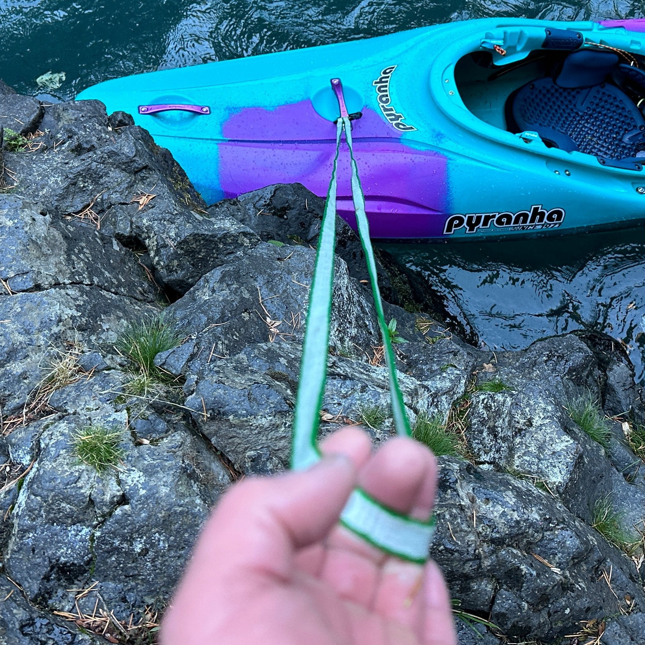 River Hardware rafting flip line attached to a safety harness, used for rescue and stability during whitewater rafting adventures.