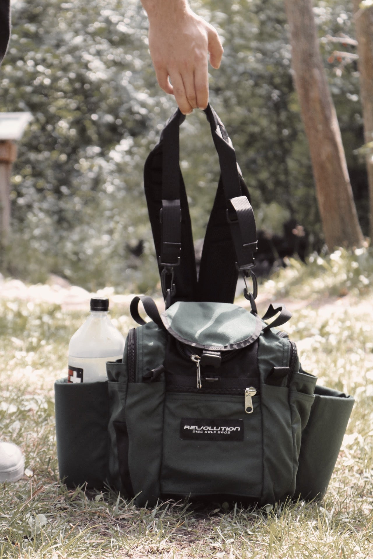 Gotta Go Gotta Throw Revolution Mini Deluxe V3 disc golf bag in Mountain Mist color with multiple compartments and durable design.