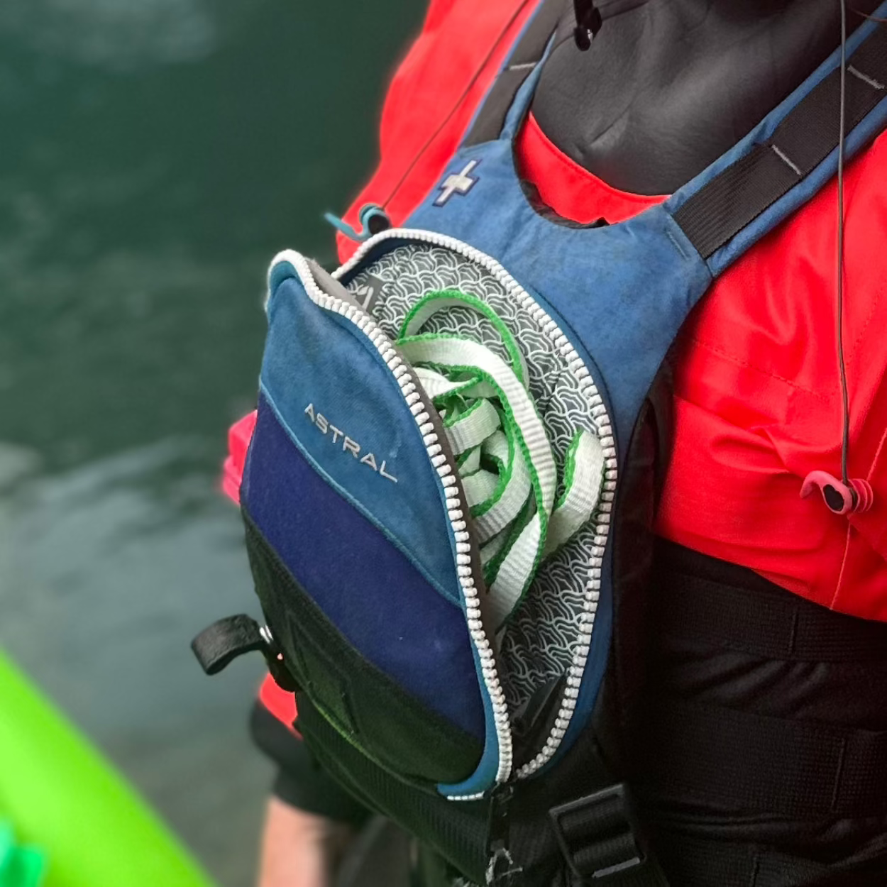 River Hardware rafting flip line, durable safety rope with reinforced handles for secure grip during whitewater rafting.