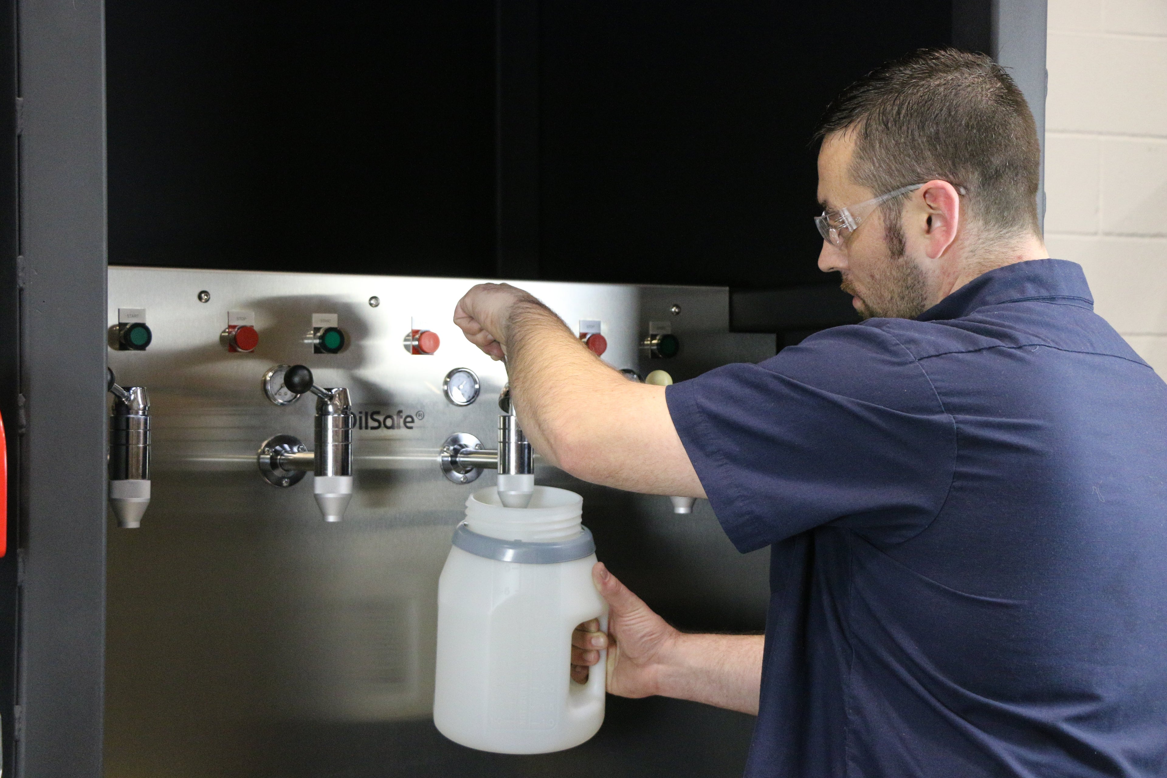 OilSafe Starter Kit with DRIVEN Racing Shop fluid transfer containers for automotive oil and fluid management.