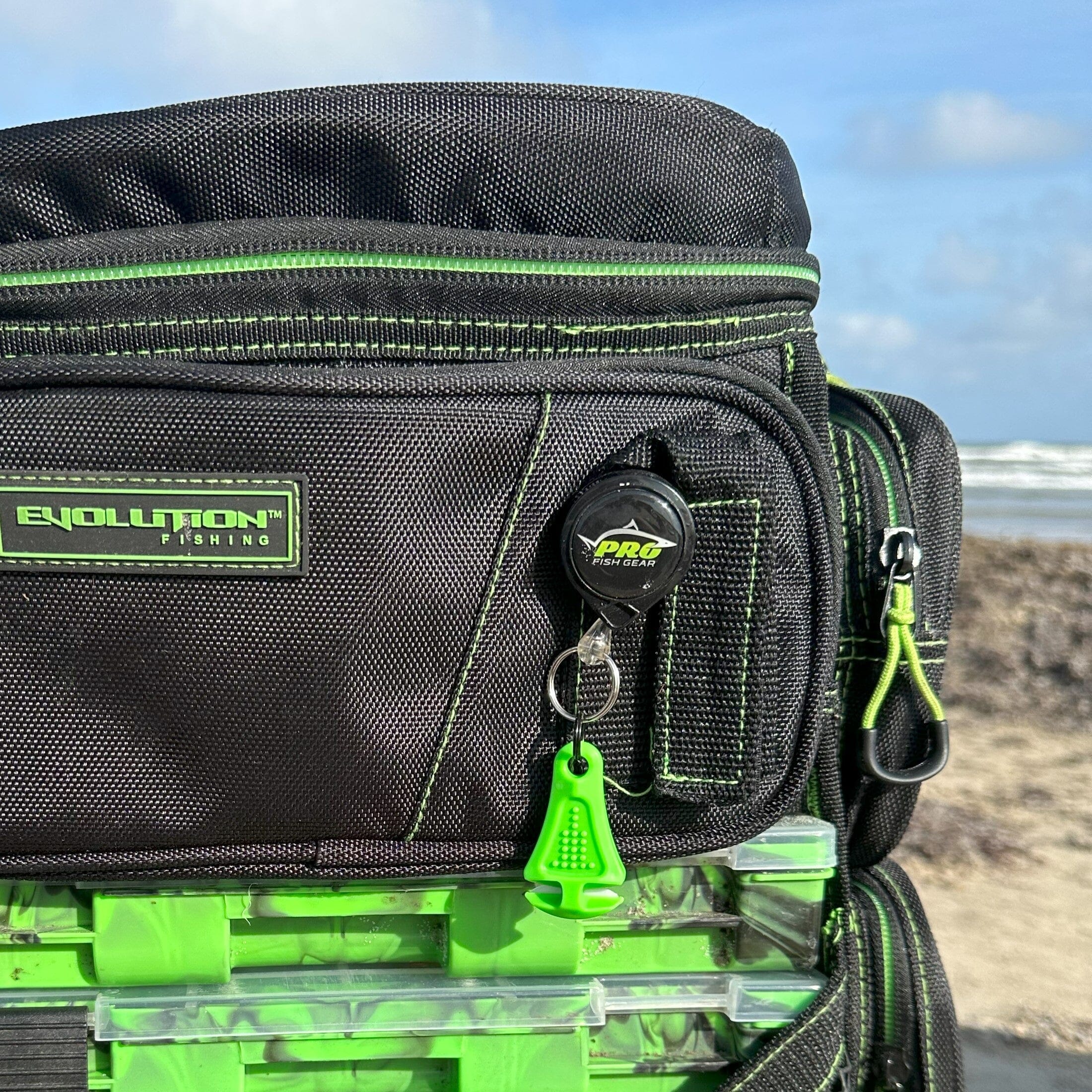 Green Line Cutterz zipper pull featuring a ceramic blade design for easy attachment and enhanced functionality.