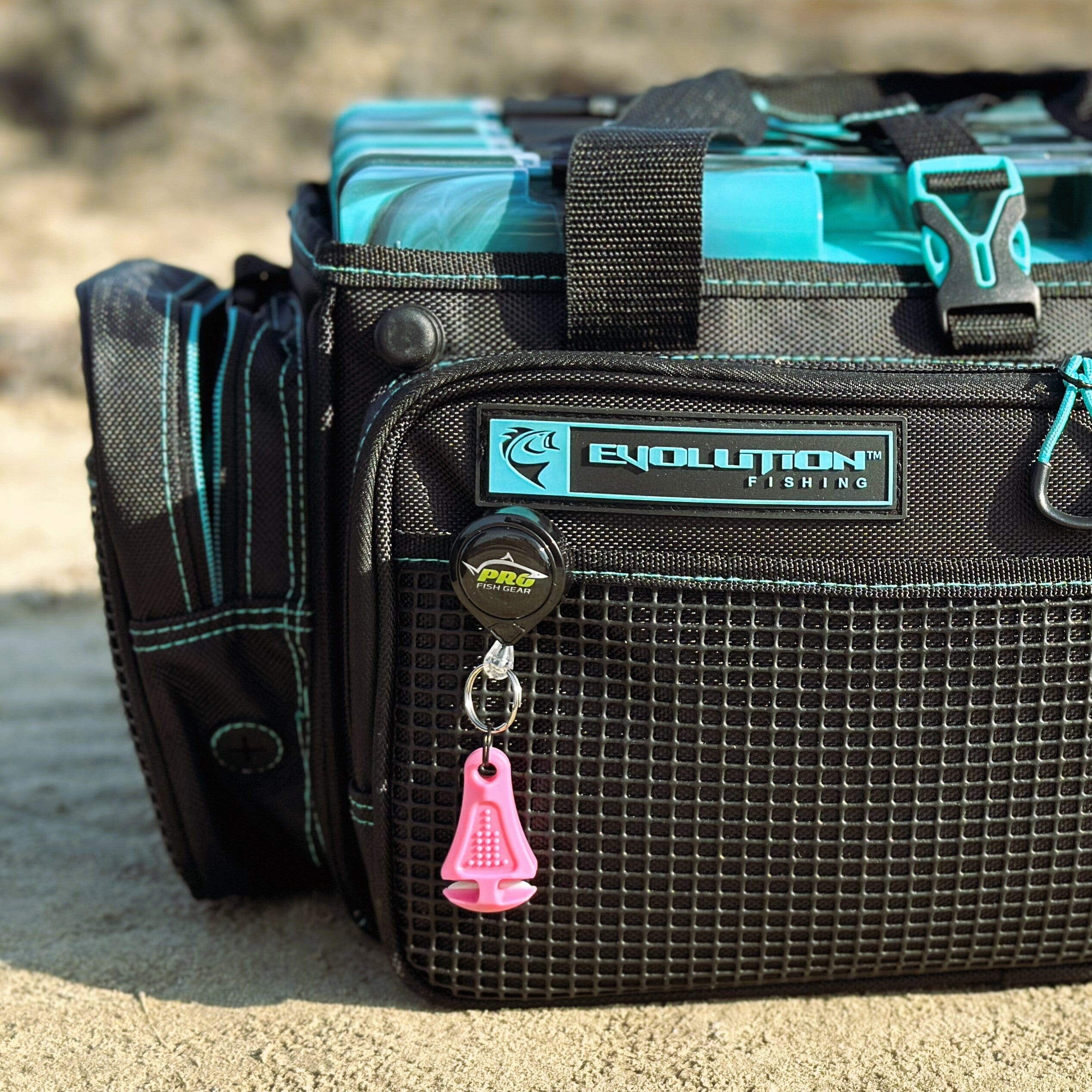 Line Cutterz ceramic blade zipper pull in pink, lightweight and durable accessory for jackets and bags.