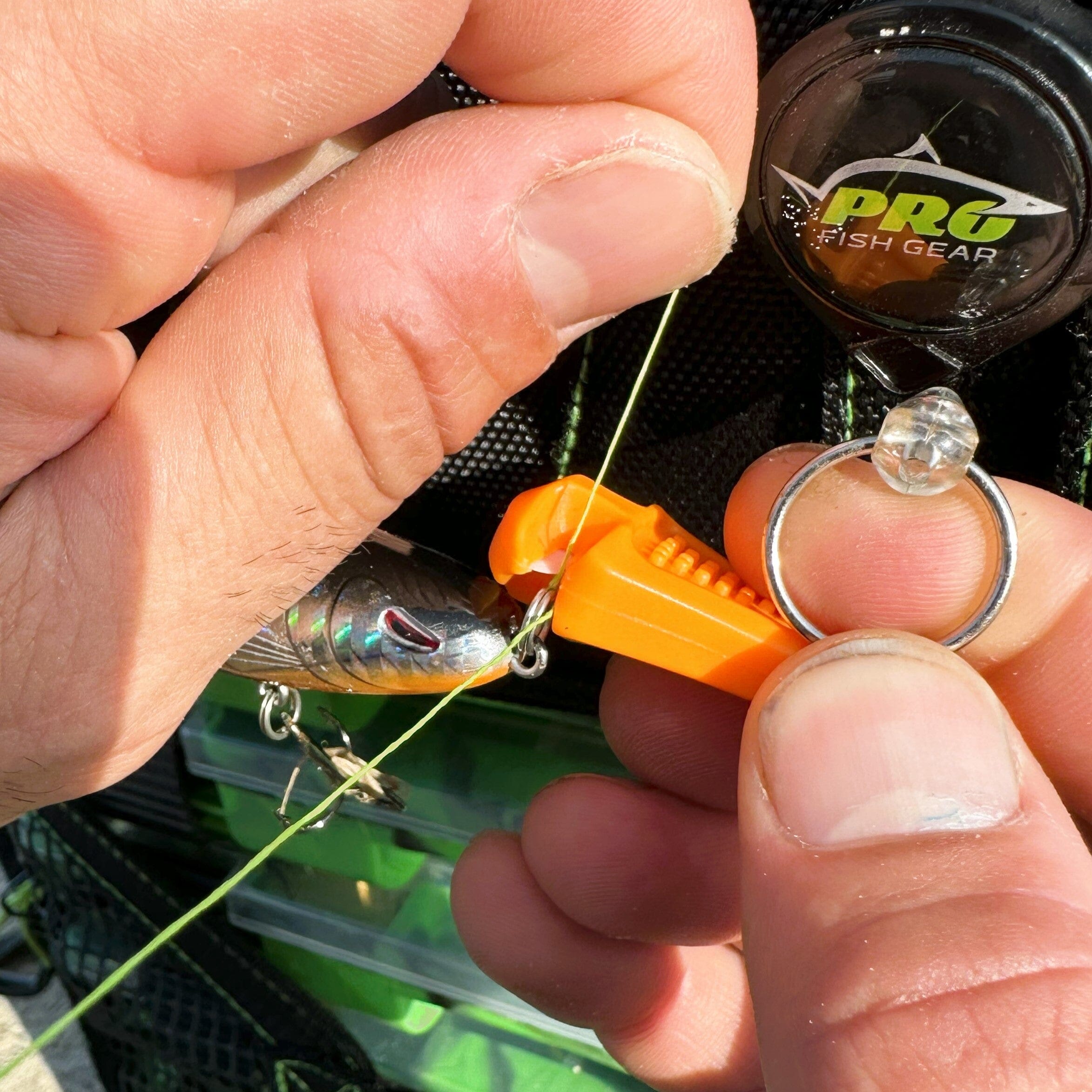 Blaze orange Line Cutterz ceramic blade zipper pull with a sleek design and easy-grip for quick access.