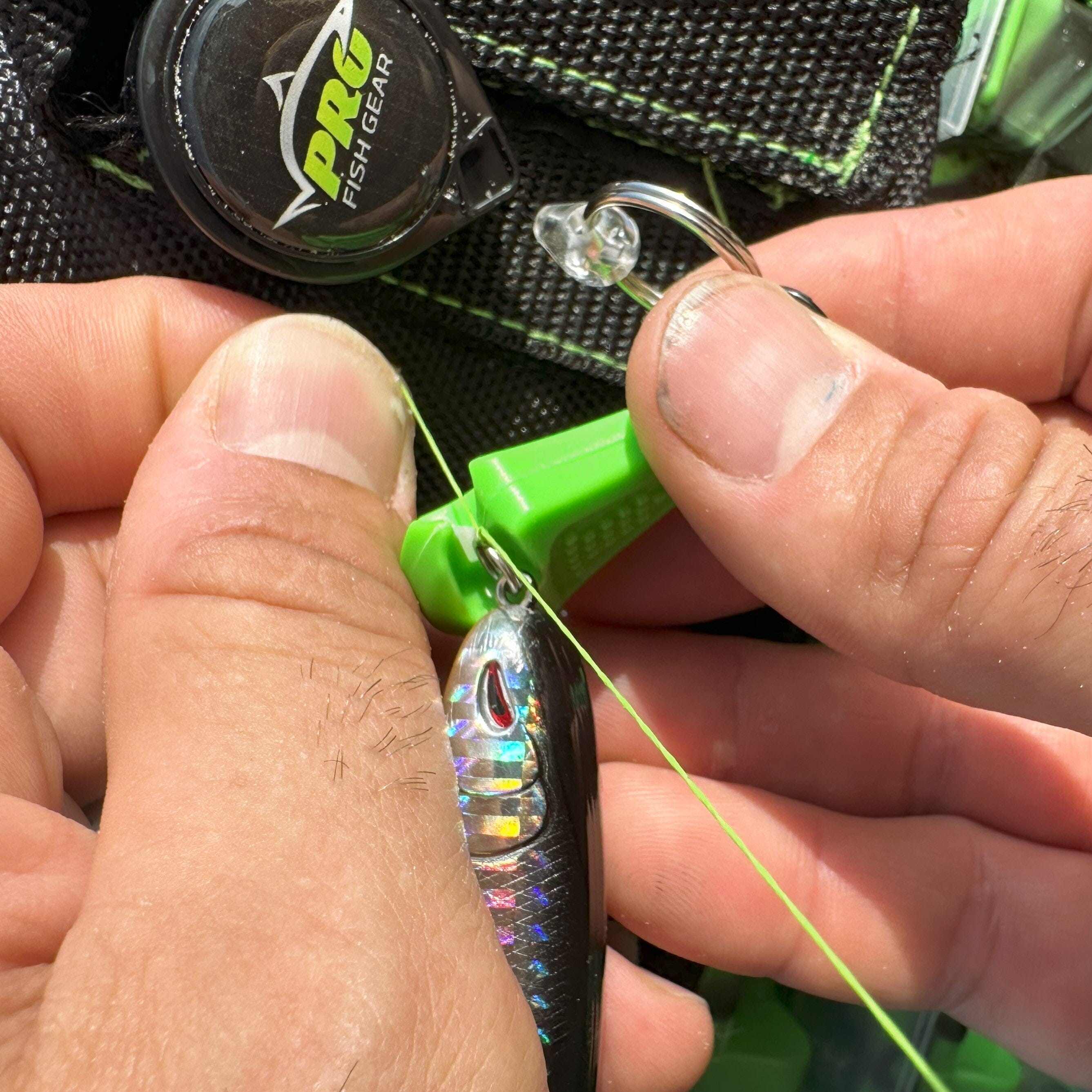 Green Line Cutterz ceramic blade zipper pull showcasing a compact design with a smooth finish and functional clasp.