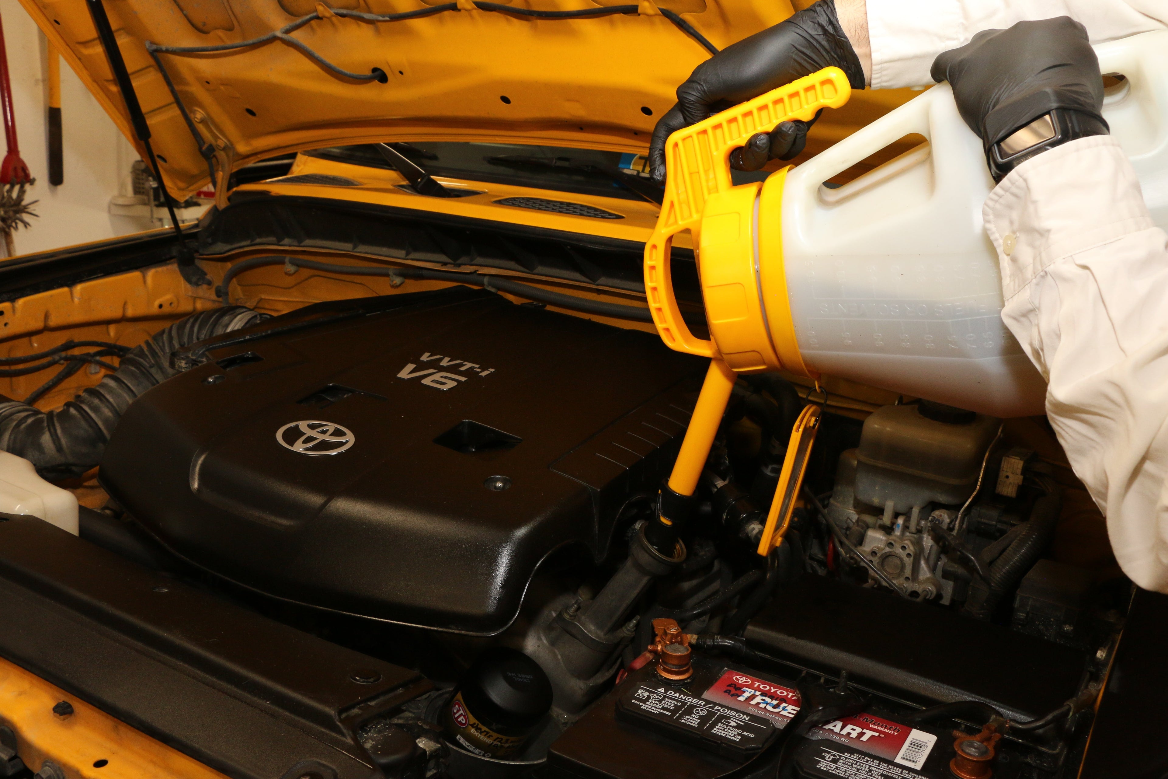 OilSafe Stretch Spout transfer container lid by DRIVEN Racing Shop, featuring controlled-flow oil transfer for easy use.