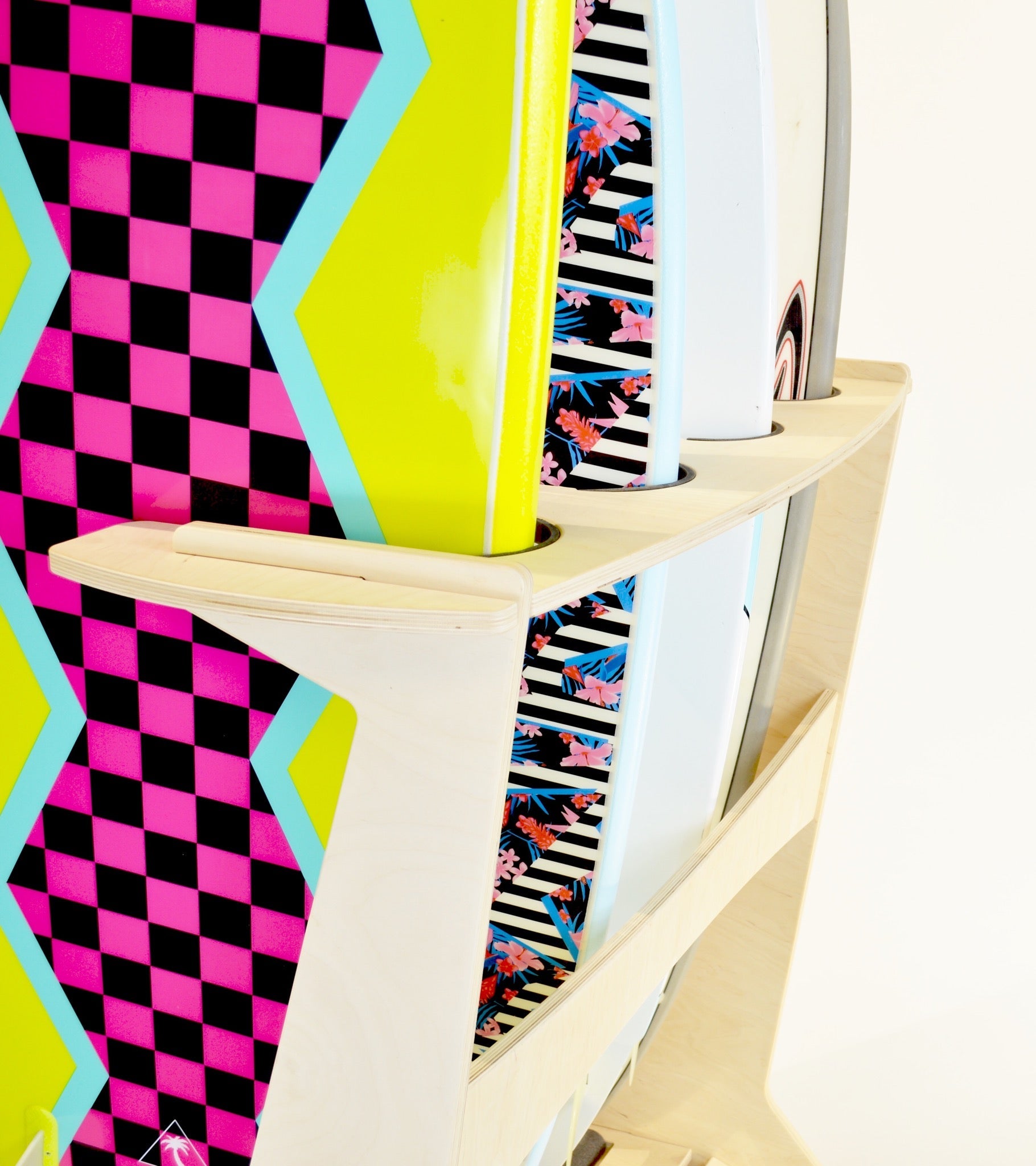 Freestanding surfboard rack by Rado Racks, showcasing multiple surfboards in a stylish, organized display.