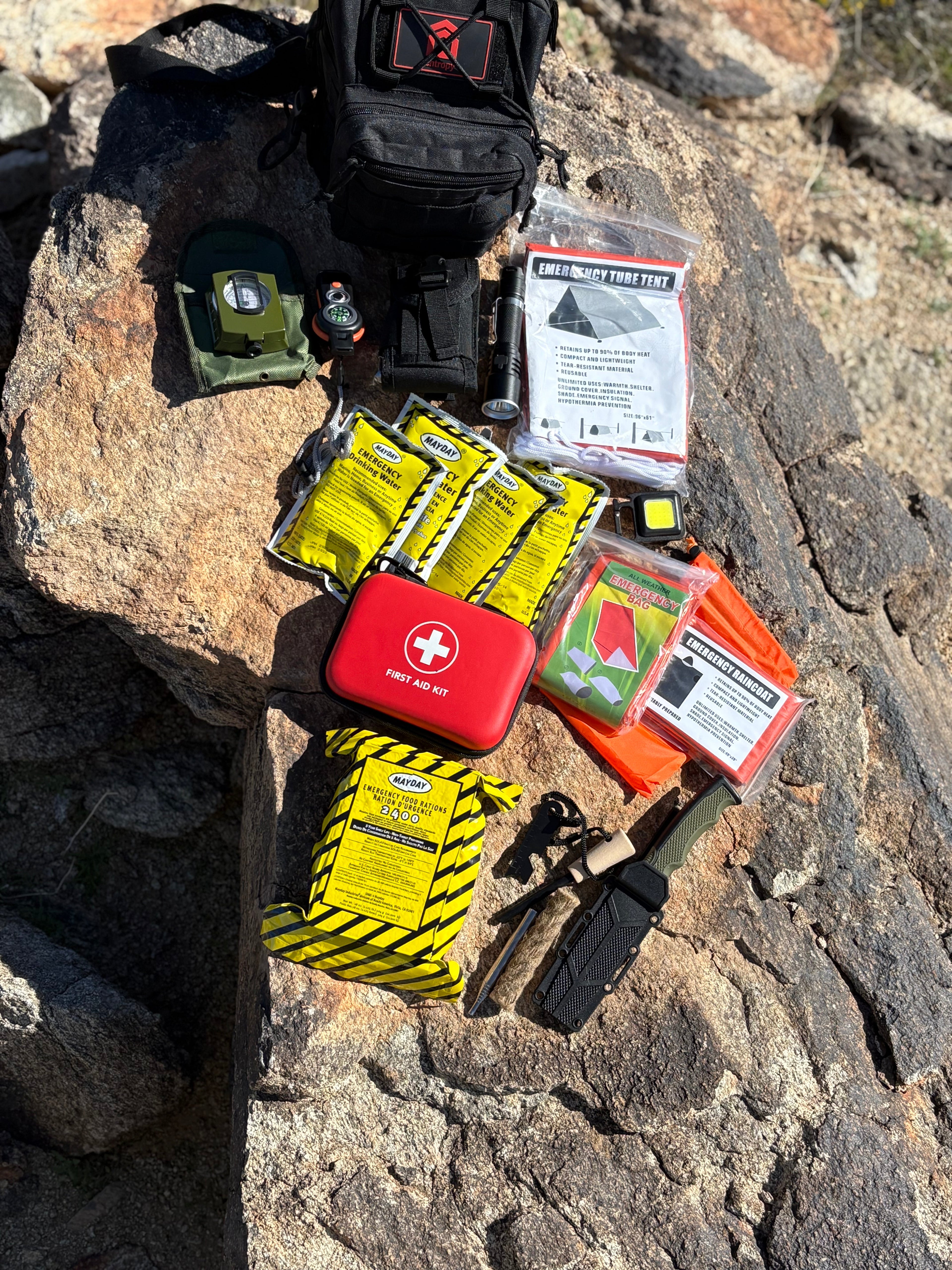 Entropy Survival Safe Trail 'Survive All' Go Bag emergency preparedness kit with compact, durable supplies for survival.
