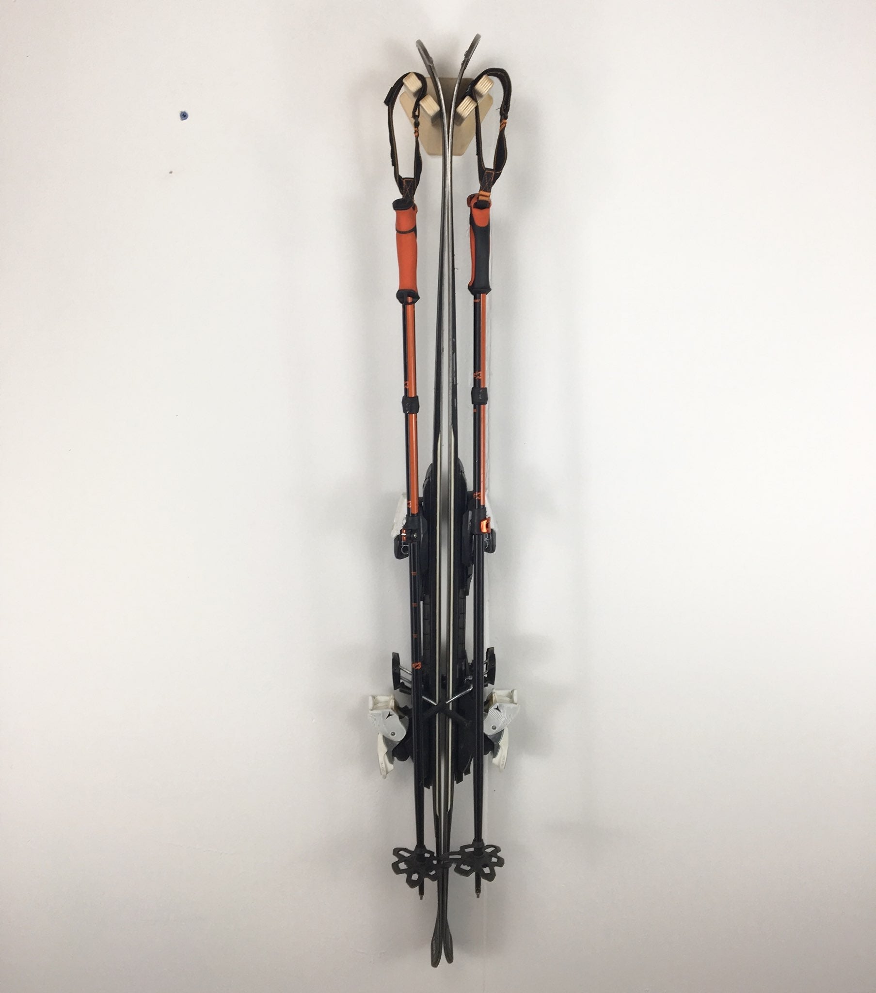 Rado Racks THE JIB ski wall rack displaying skis mounted on a stylish wall-mounted design.